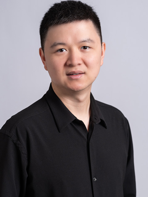 Portrait photograph of staff memeber, Yang Zou